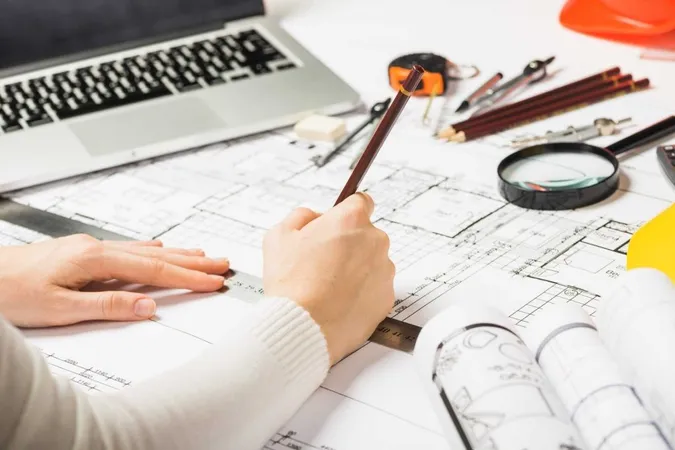 Architect Drawing Blueprint With Pencil X - Architect Registration Examination study guide