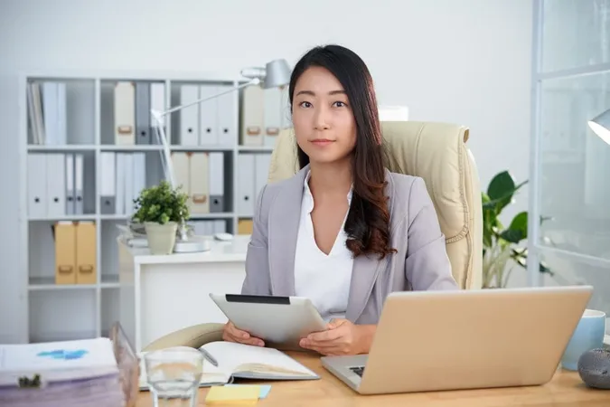 Young Asian Business Lady Posing Office With Tablet Front Laptop X - Certified Career Counselor study guide