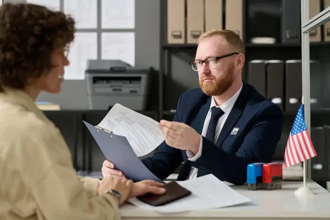 Portrait Bearded Male Consultant Working Us Embassy Office Holding Application Form While 1 X - California Certified Paralegal study guide