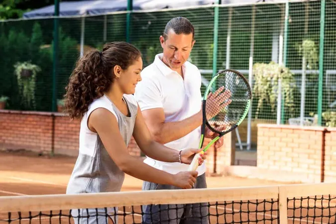 Teenage Girl Sportive Outfit Standing With Her Coach X - International Tennis Federation Coaching Certification study guide